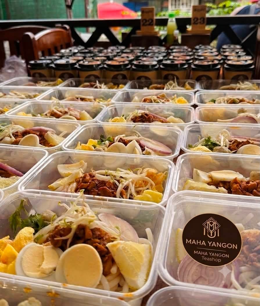 Catering boxes sealed with the Maha Yangon Teashop sticker